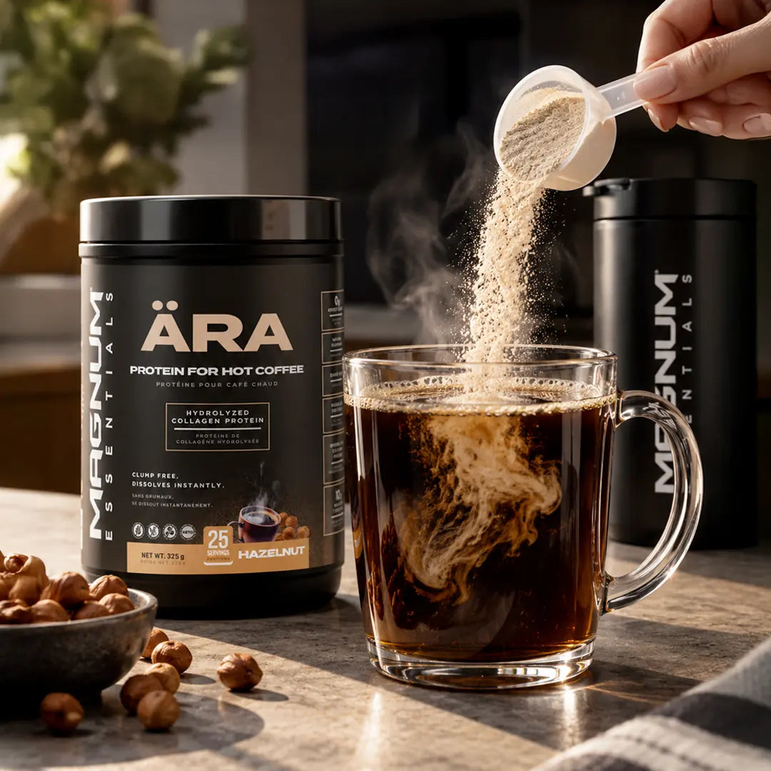 ÄRA Hazelnut pouring into a glass mug of hot coffee next to a bowl of hazelnuts